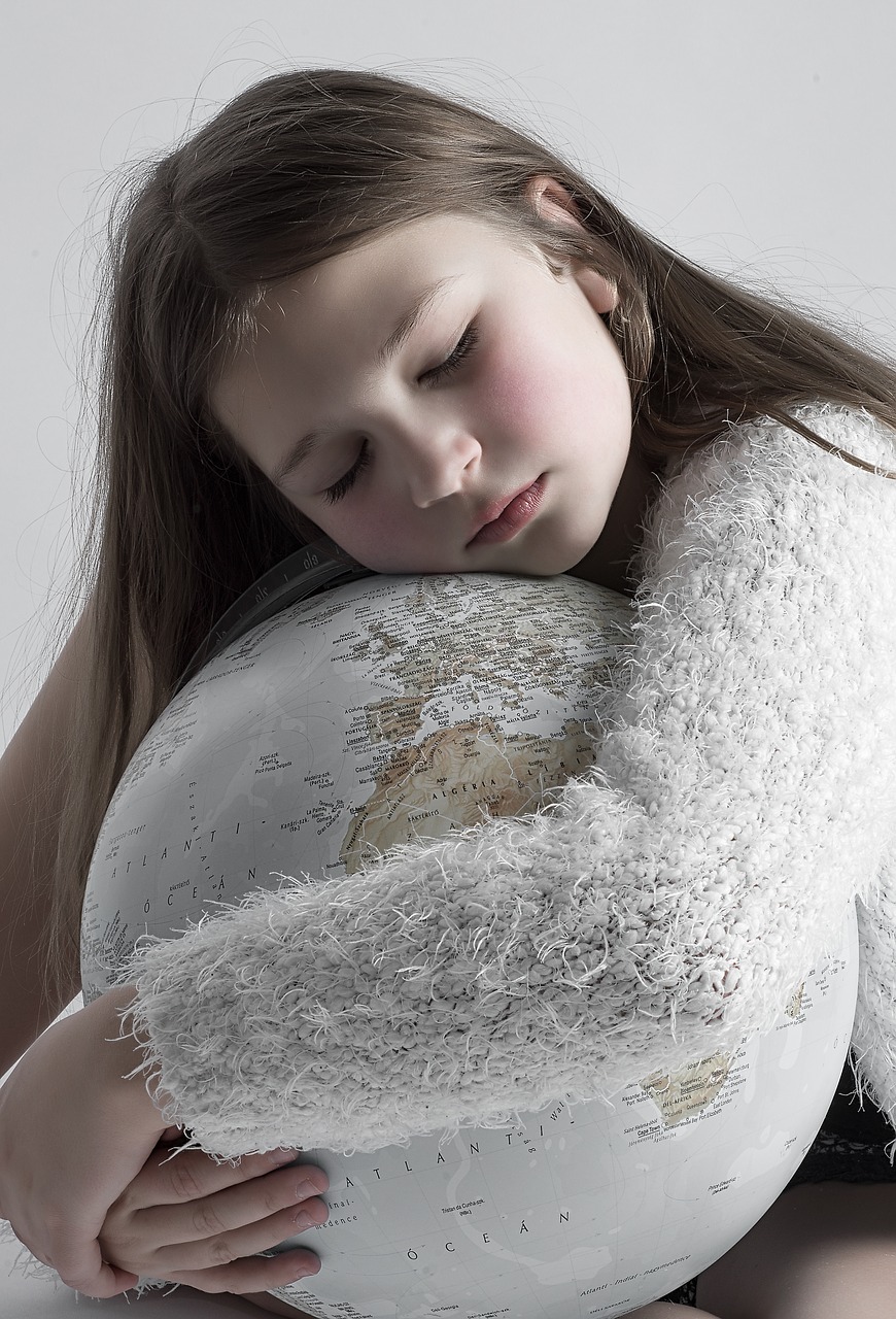 Girl hugging globe